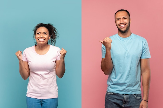 Verrückt werden Lachender Afroamerikaner, der auf seine schreiende verrückte Freundin zeigt, blauer und rosafarbener Hintergrund