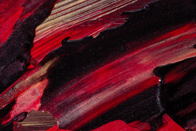Verschmierte Farbe in roter und schwarzer Strichstruktur