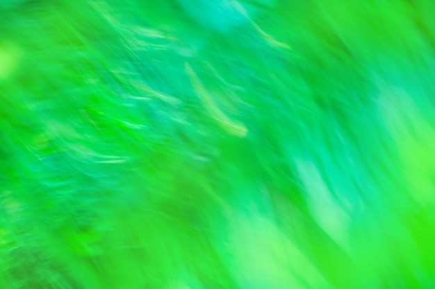 Verschwommener Bokeh-Hintergrund in Mangofarbe Grüner Dunst-Bokeh-Hintergrund