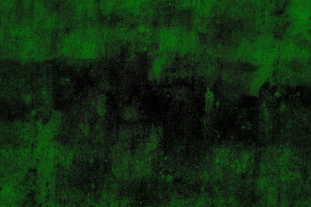 Verstreute grüne Grunge-Textur auf einer alten, verlassenen Wandfläche aus Zementputz für den Hintergrund