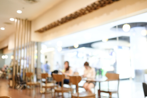 verwischen Menschen im Café mit Bokeh hellen Hintergrund