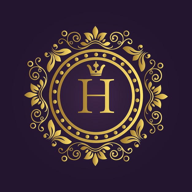 Verziertes goldenes Emblem mit Blumenrollen und dem Buchstaben H auf lila Hintergrund