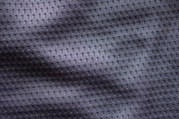 Foto vestuário desportivo de tecido cinza camisola de futebol com fundo de malha de ar