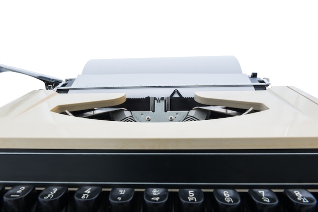 Foto vieja máquina de escribir con papel