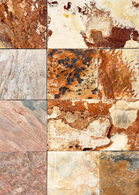 Foto vieja pared de piedra natural de pequeñas partes cuadradas de granito de mármol fondo o textura para el interior