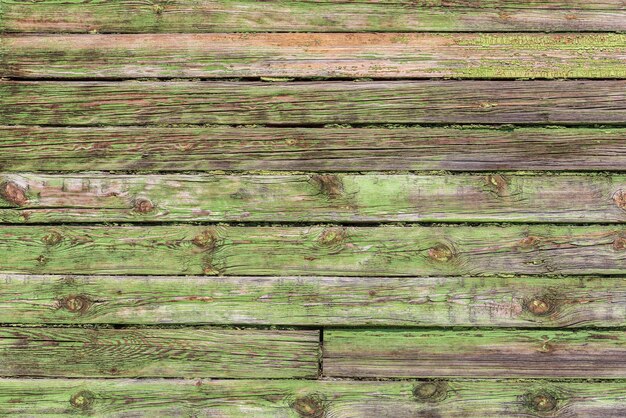 Vieja pared de tablero con textura de madera de pintura verde pelada