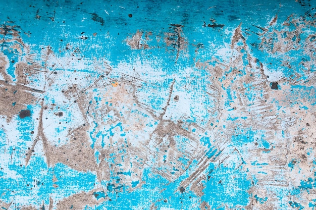 Vieja pintura descascarada en el viejo muro de hormigón azul backgroundGrunge fondo o textura de pared azul