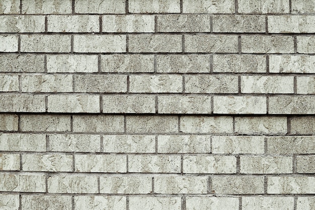 Vieja textura de fondo de pared de ladrillo gris