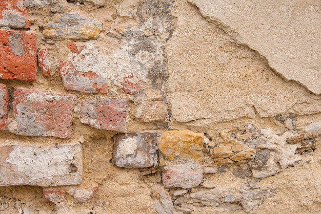 Foto vieja textura de fondo de pared de piedra beige