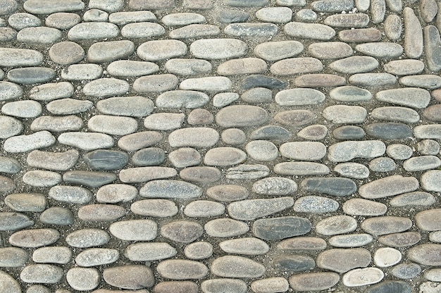 Vieja textura de fondo de pavimento de piedra gris