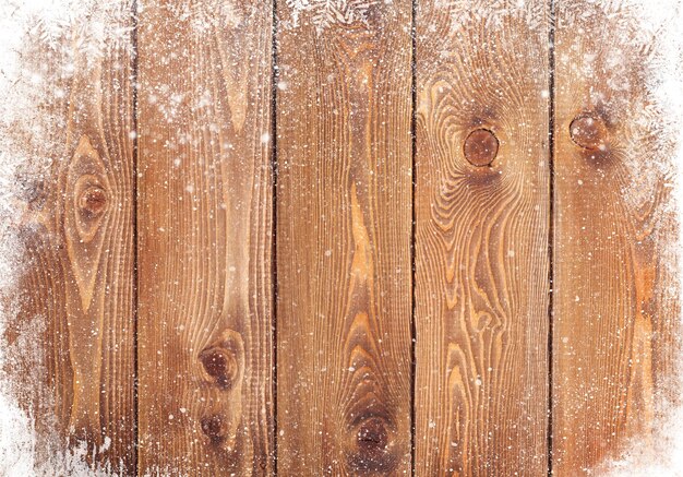 Vieja textura de madera con nieve