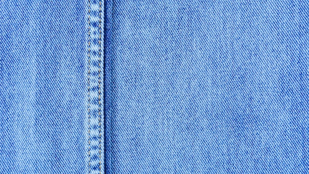 Viejo azul pálido de costura denim jean textura.