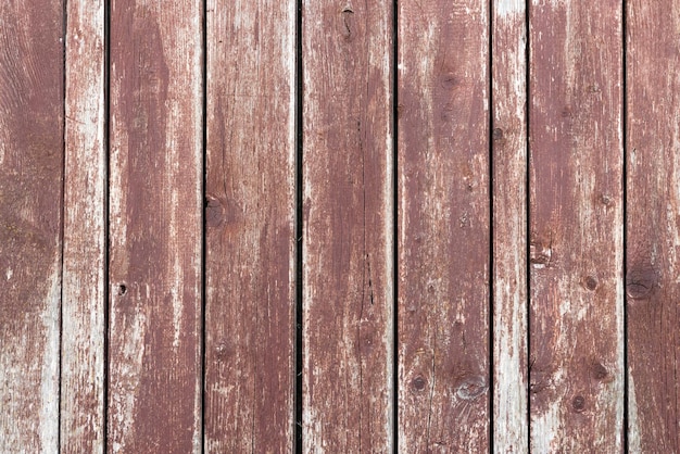 Viejo fondo de madera con pintura marrón agrietada que se pela