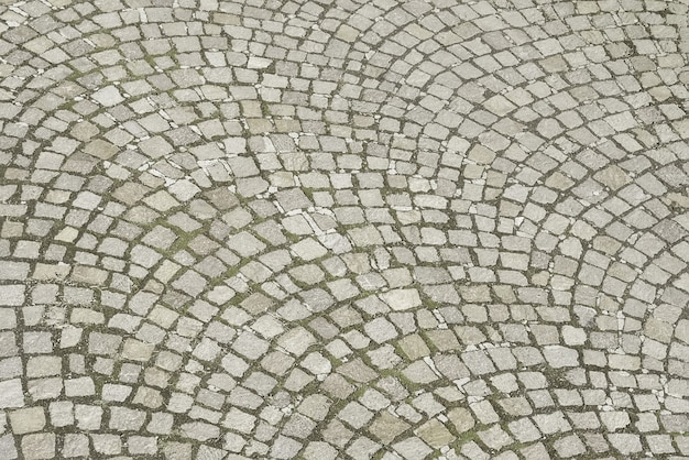 Viejo fondo de pavimento de piedra gris