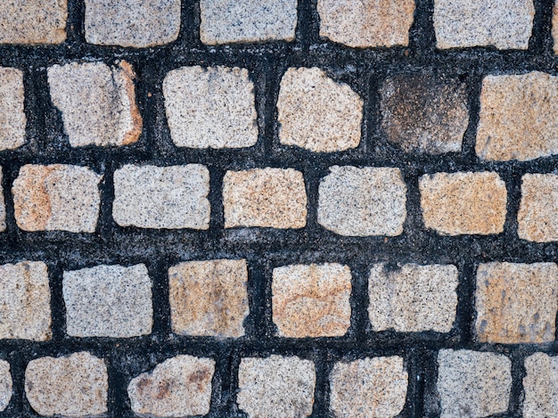 Viejo muro de ladrillo de piedra y cemento