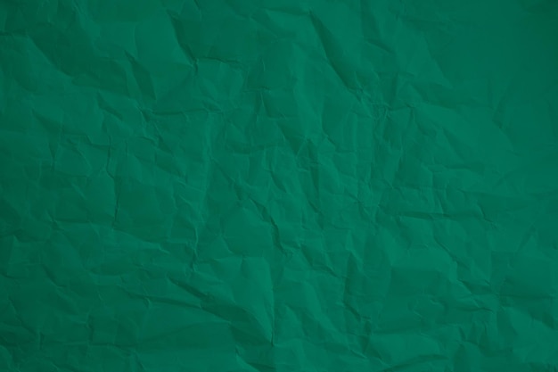 Viejo papel verde arrugado con textura de fondo grunge papel tapiz angustiado