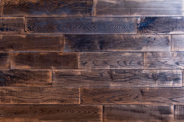 Viejo parquet oscuro texturizado Textura de madera Fondo de madera natural en mal estado primer plano