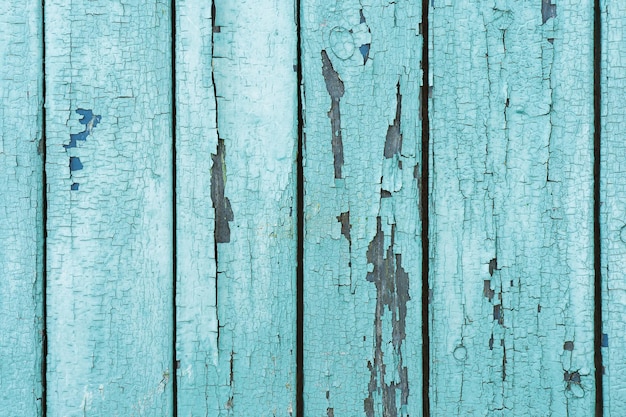 Viejos tablones de madera con pintura azul pelada agrietada Fondo de textura pintada Fondo rústico