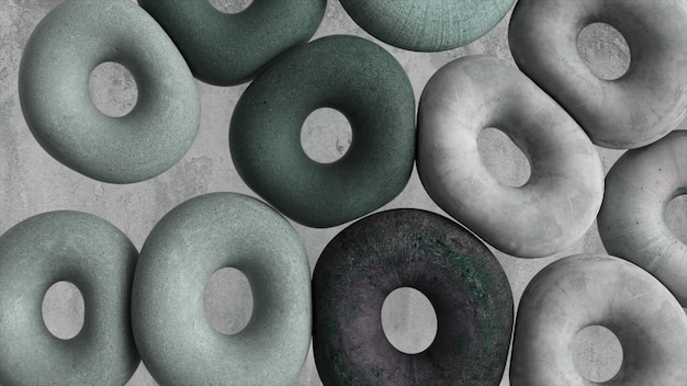 Viele graue weiche Donuts auf grauem Hintergrund Abstraktes Konzept Runde Objekte Spielzeug 3D-Darstellung