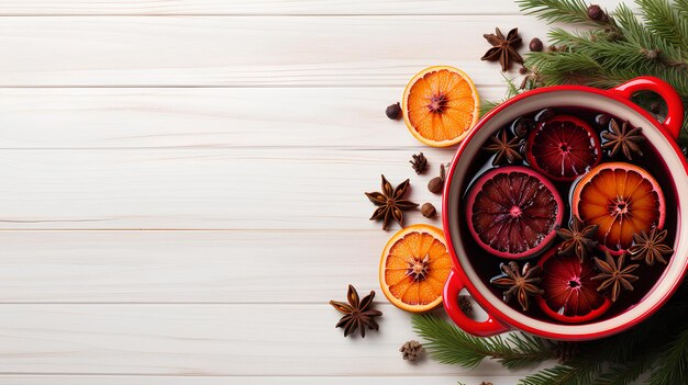 Vino de Navidad en una sartén con naranjas