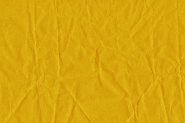 Foto vintage amarelo e fundo de papel amassado com aparência antiga