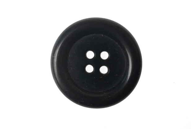 Vintage botón negro aislado sobre fondo blanco.