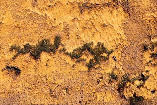 Vintage-Rahmen, strukturierter Grunge-Hintergrund. Abstrakte alte Oberfläche Nahaufnahme von Gelb, Orange und Braun. Bunter zerkratzter Hintergrund