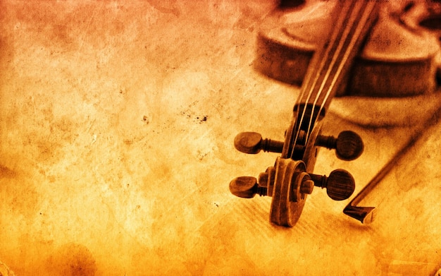 Foto violín clásico sobre un fondo de papel grunge