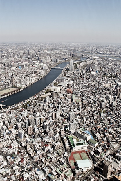 Vista aérea, de, arranha-céu, edifícios, em, cidade tóquio, modernos, skyline, e, urbano, fundo