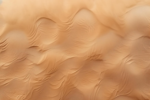 Una vista aérea de una playa de arena con una superficie de arena texturizada que sirve como fondo para maquetas y