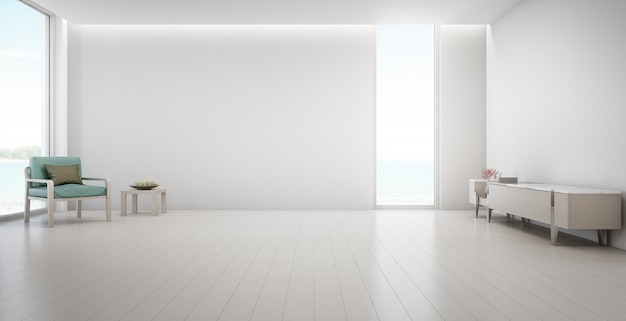 Vista al mar gran salón de casa de verano de playa de lujo con soporte de TV y mueble de madera.