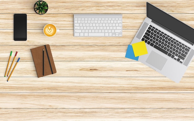 Vista de ángulo alto de la computadora portátil con café y suministros de oficina en la mesa de madera