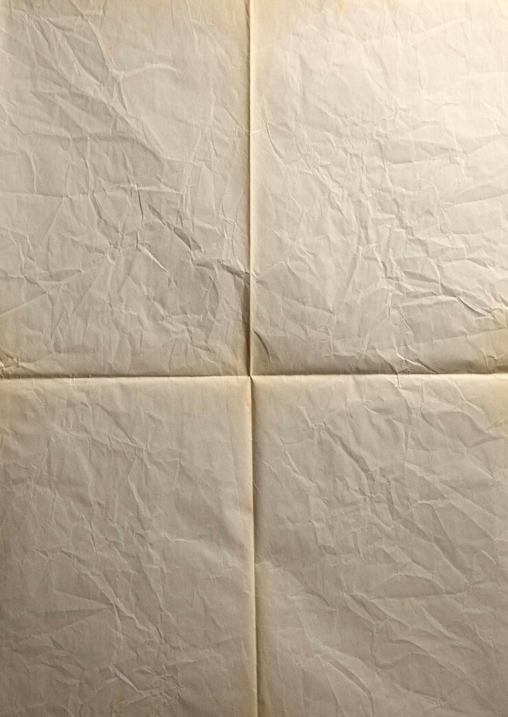 Foto vista de ángulo alto del papel blanco en la cama
