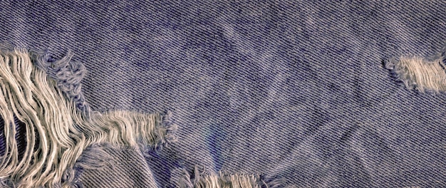 Vista aproximada textura de denim limpo natural azul Textura de tecido de jeans de perto Textura de jeans rasgado azul