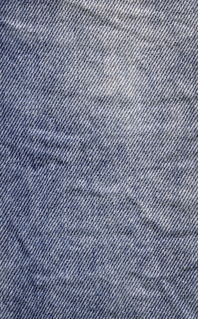 Vista aproximada textura de denim limpo natural azul Textura do tecido de jeans close-up Fundo de denim de jeans