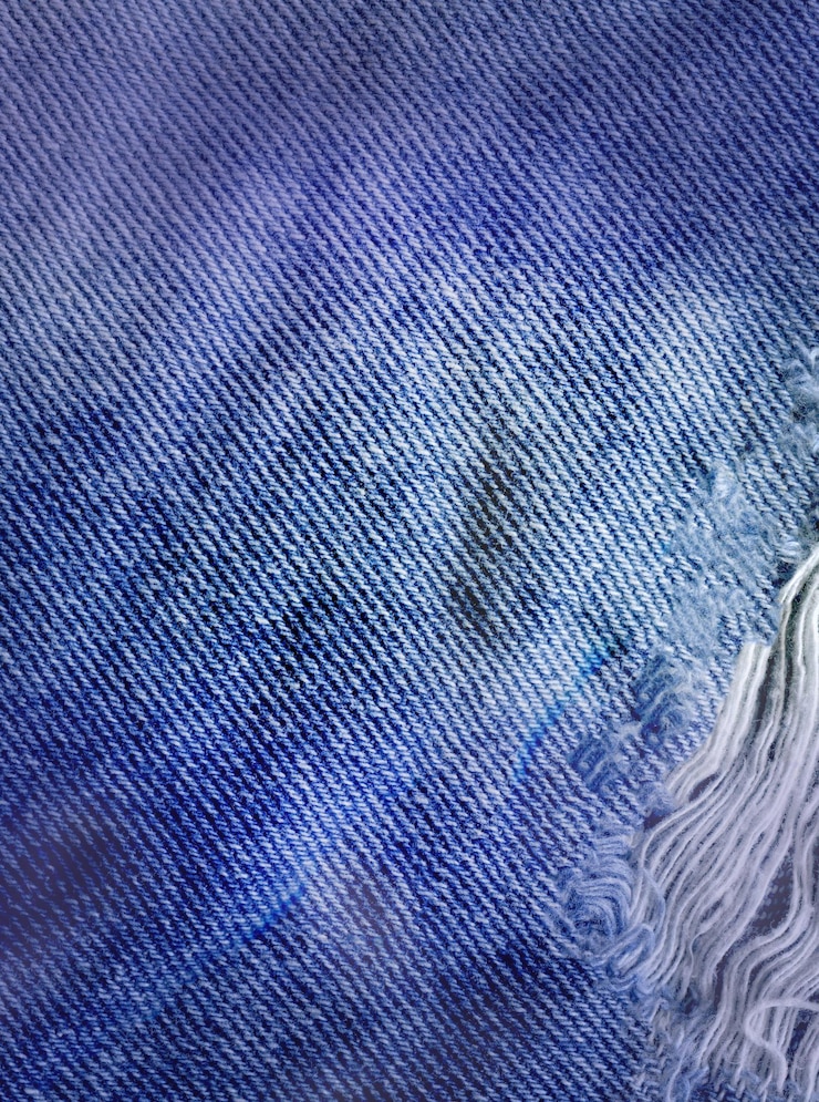 Vista aproximada textura de ganga limpa azul Textura de ganga azul rasgada