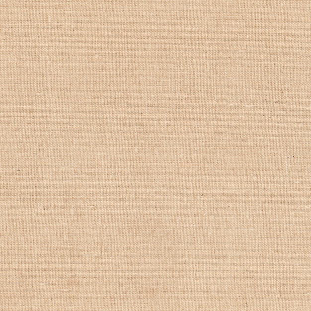 Vista de cerca de una tela de lino beige con textura