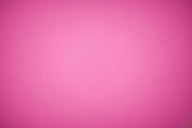 Vista de cerca de la textura de la tela de lana púrpura Primer plano de material textil de tela rosa como textura o fondo Fondo rosa con texturas y viñeta