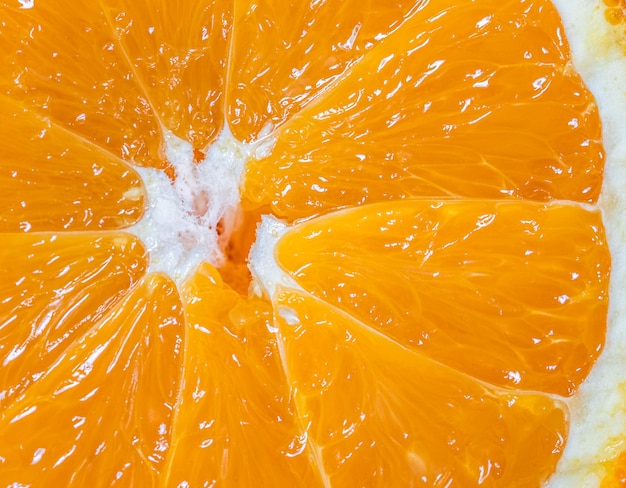 Foto vista cercana de fondo de rodaja de fruta naranja