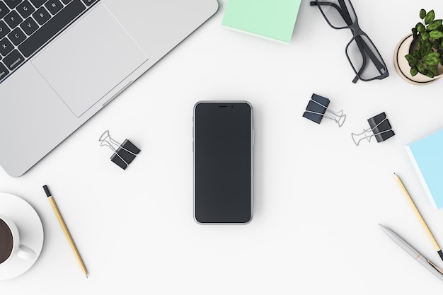 Vista de cima na tela preta do smartphone em branco com copyspace para o seu texto ou logotipo na superfície clara com ferramentas de escritório para laptop e óculos renderização em 3D mock up