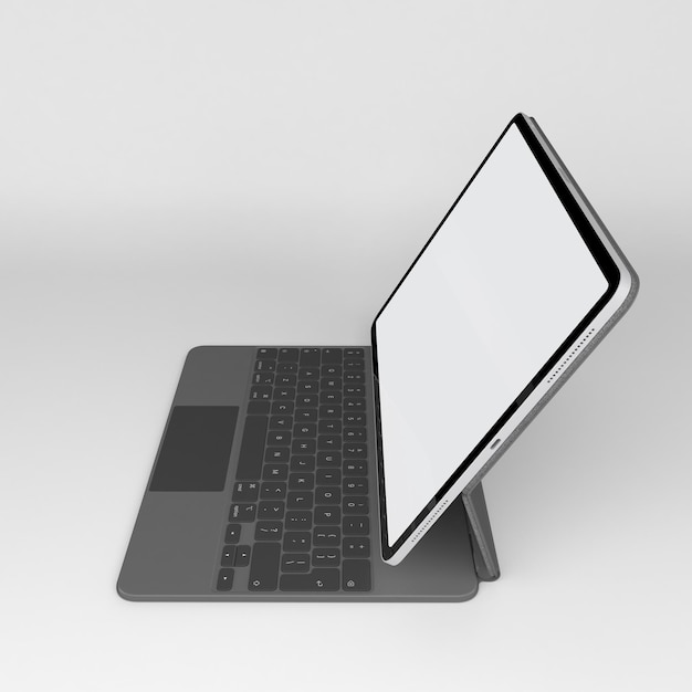 Vista lateral de la perspectiva del teclado mágico y la tableta aislada en fondo blanco
