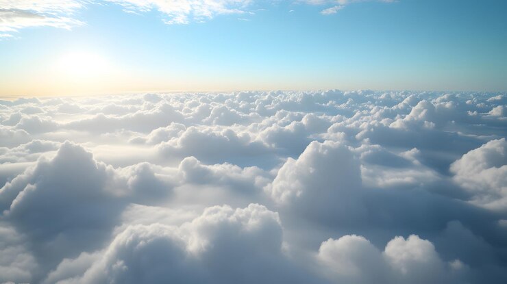Una vista de nubes blancas y esponjosas desde arriba con un cielo azul brillante