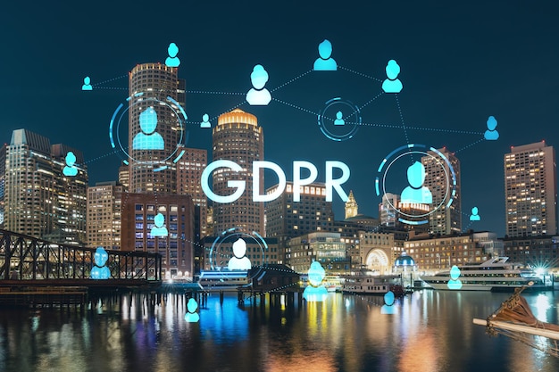 Vista panorámica de la ciudad del puerto de Boston y Seaport Blvd por la noche Los exteriores de los edificios de Massachusetts del holograma GDPR del centro financiero es la privacidad de la regulación de protección de datos para todas las personas