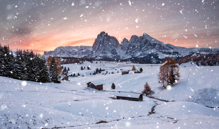 Foto vista panorámica del paisaje cubierto de nieve contra el cielo al atardecer