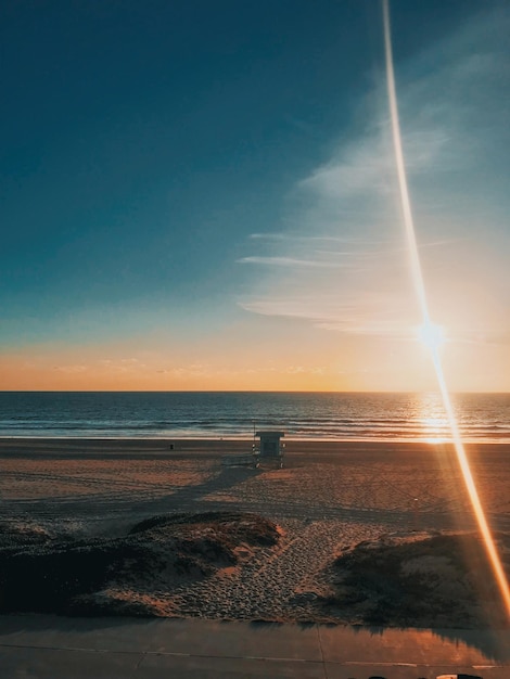 Foto vista panorámica de la playa contra el cielo durante la puesta de sol