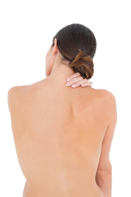 Foto vista posterior de una mujer apta en topless con dolor en el hombro