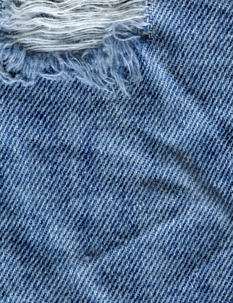 Vista de primer plano textura de mezclilla limpia azul Textura de jeans rasgados azules