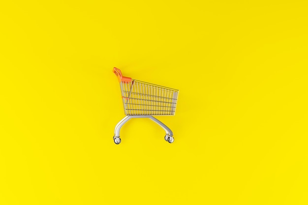 vista superior del carrito de compras vacío en la ilustración 3d de fondo de color