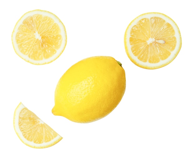 Vista superior conjunto de hermosos frutos de limón amarillo con mitades y rebanadas o cuartos aislados en blanco