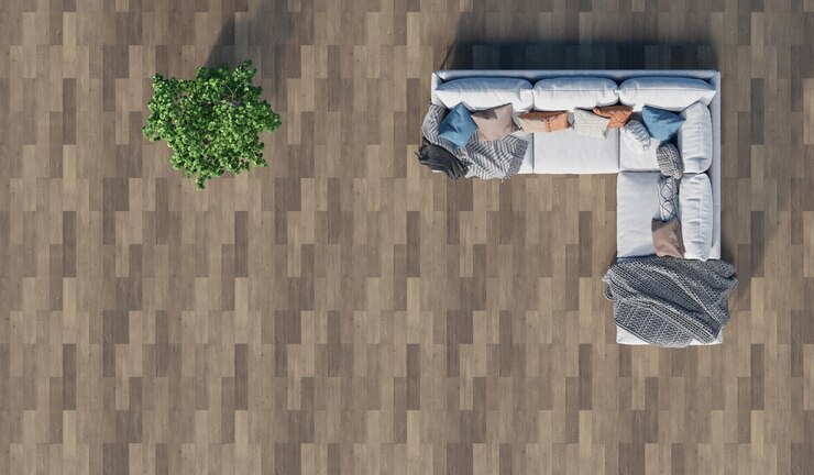 Vista superior de um sofá com plantas colocadas em um chão de madeira na sala de estar3d rendering